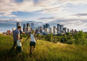 Healthy family walking together with Calgary skyline