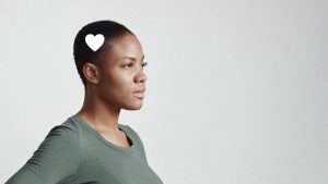 Woman in profile with heart icon near her head