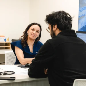 Doctor consulting with patient in clinic office