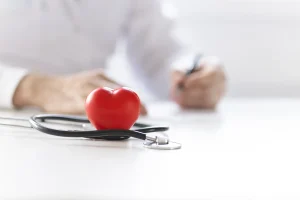 Heart and stethoscope with paperwork