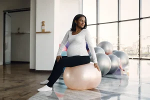 Pregnant woman exercising on a stability ball
