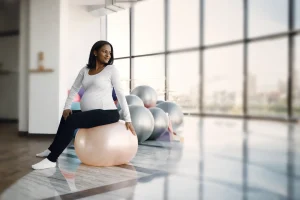 Pregnant woman exercising on a stability ball