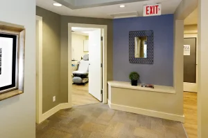 Preventous clinic hallway with open exam room