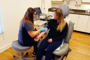 Preventous clinician with a patient during a medical assessment