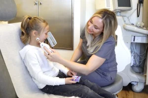Preventous nurse checking a child’s temperature