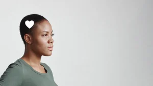 Woman in profile with heart icon near her head